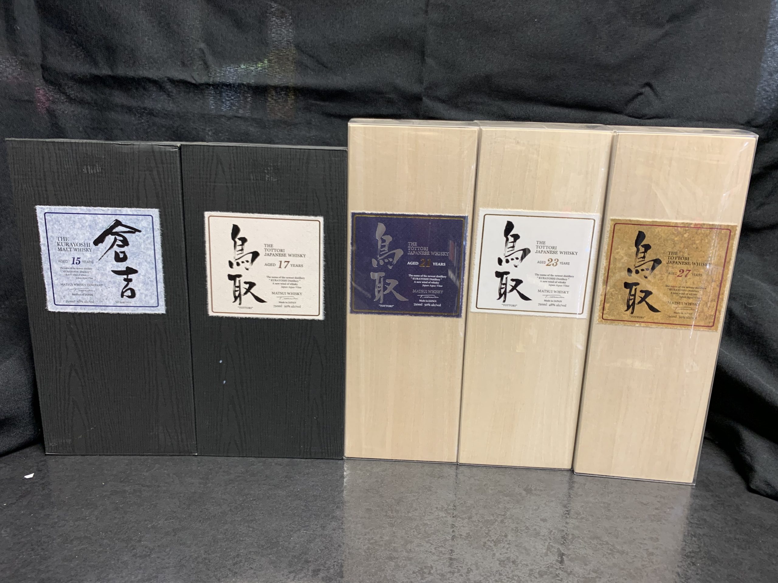 Lineup of Japanese whiskey in boxes